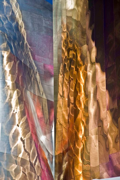Free Colorful abstract patterns reflecting on a metallic architectural facade. Stock Photo