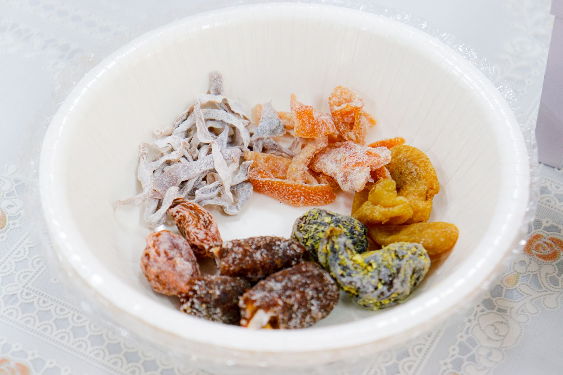 Close-up of various dried fruits in a bowl, perfect for healthy eating concepts.