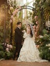Elegant Wedding Couple in Lush Garden Setting