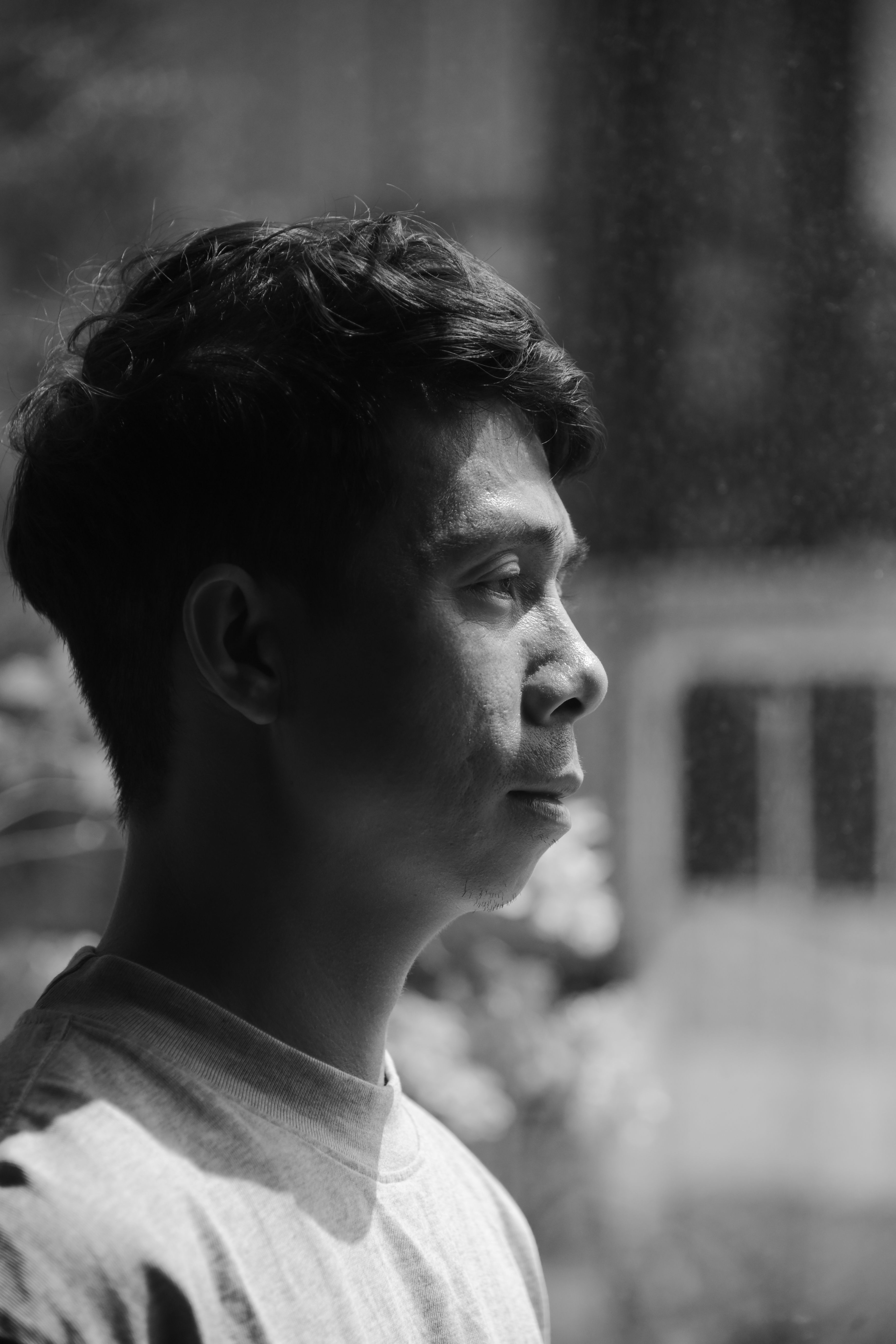 Profile Portrait of Young Man in Black and White