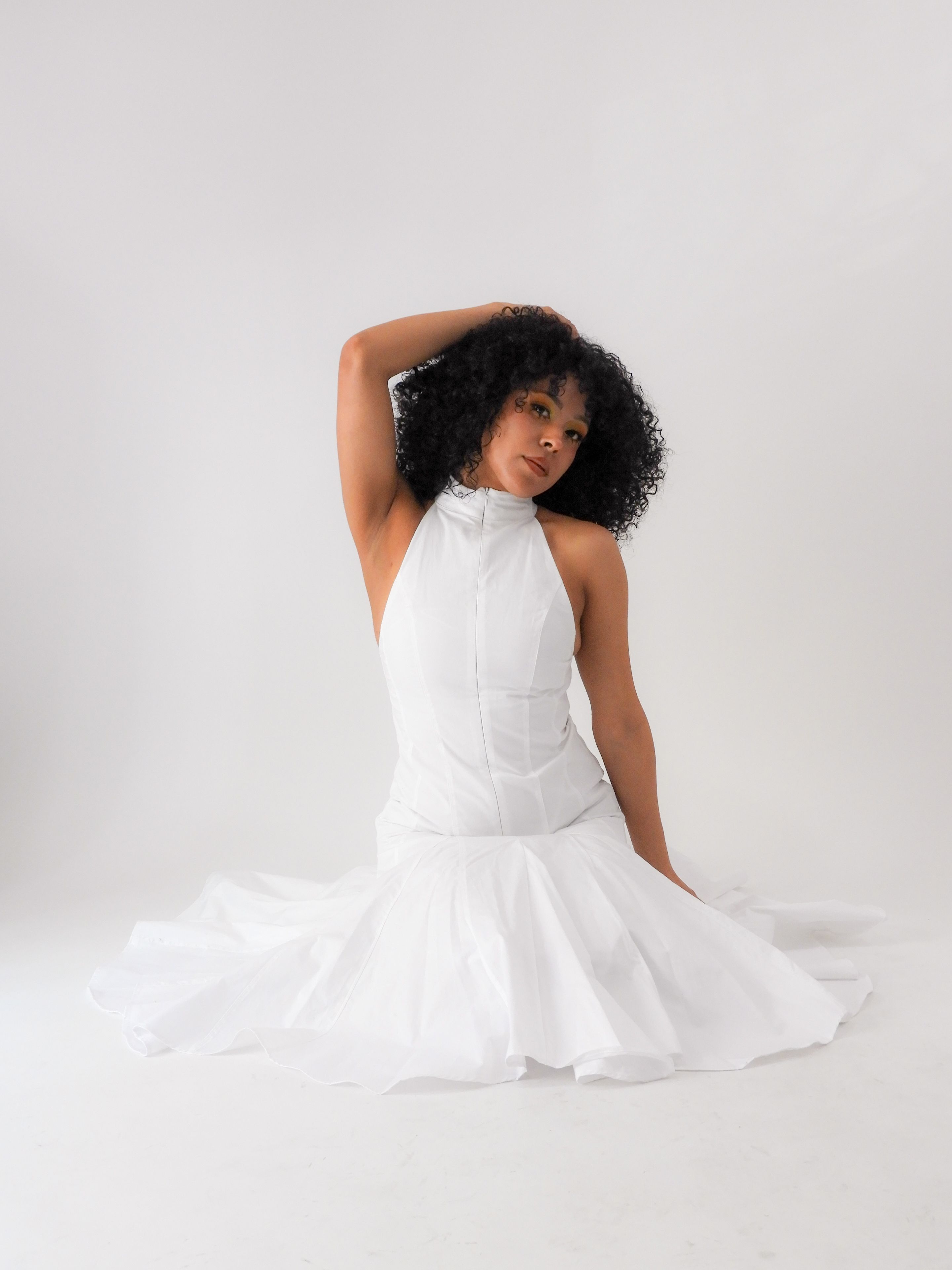 Elegant Woman Posing in White Gown · Free Stock Photo