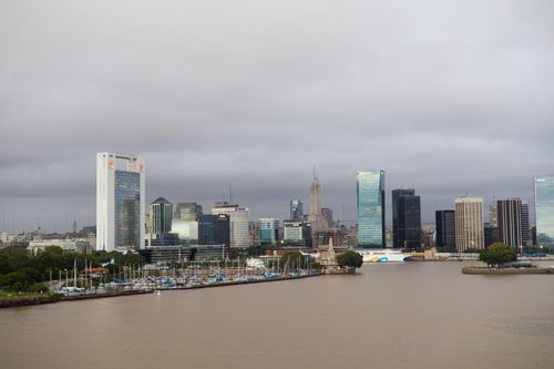 Free Skyline of Buenos Aires with modern buildings and docklands under a cloudy sky. Stock Photo