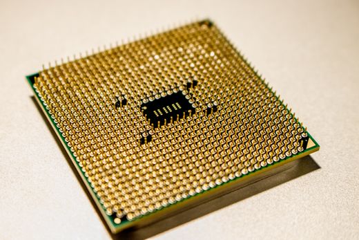 Macro shot of a gold microprocessor chip — photo by Jeremy Waterhouse on Pexels