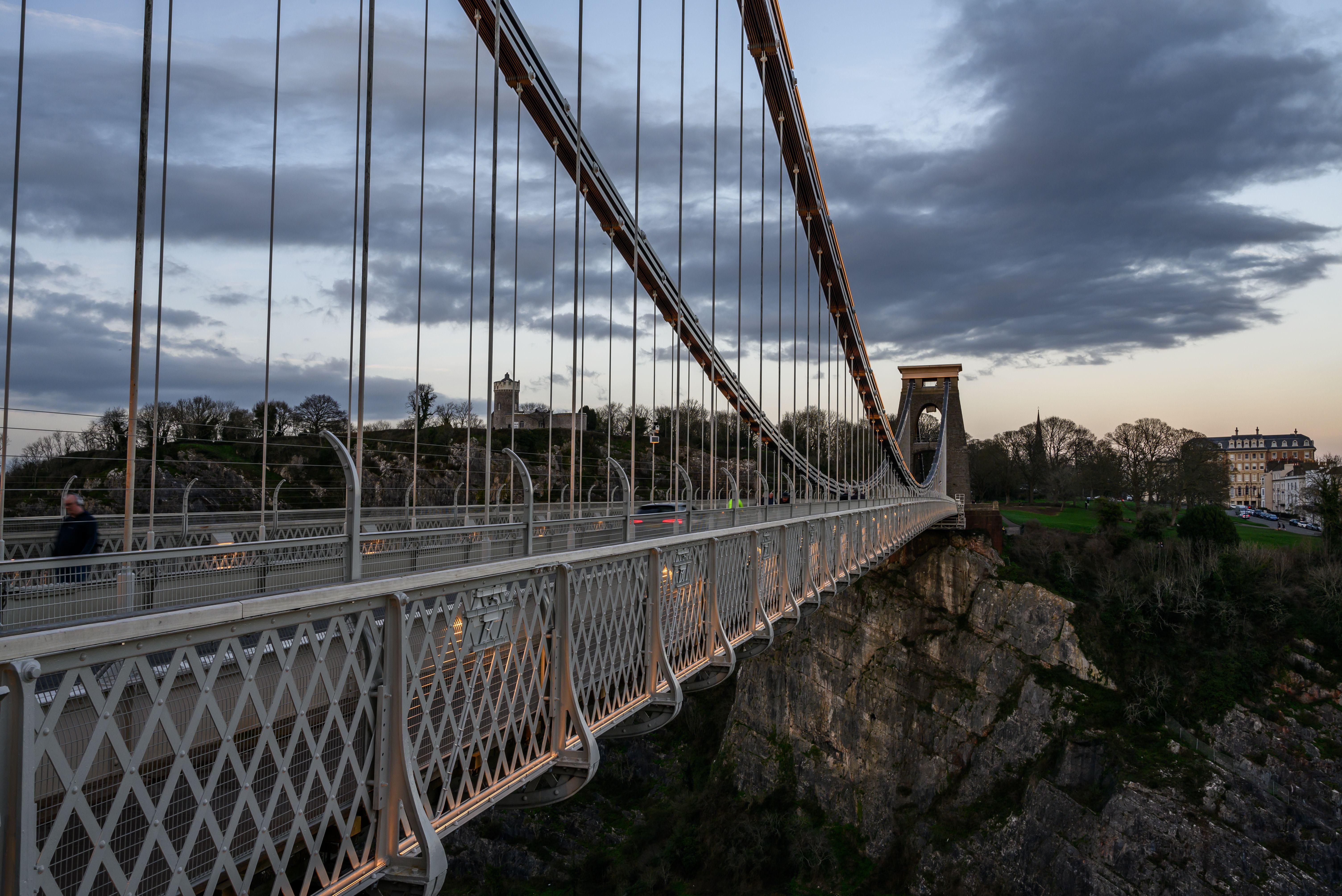 A picturesque view of the Clifton Suspension Bridge in Bristol during twilight, showcasing its architectural marvel.