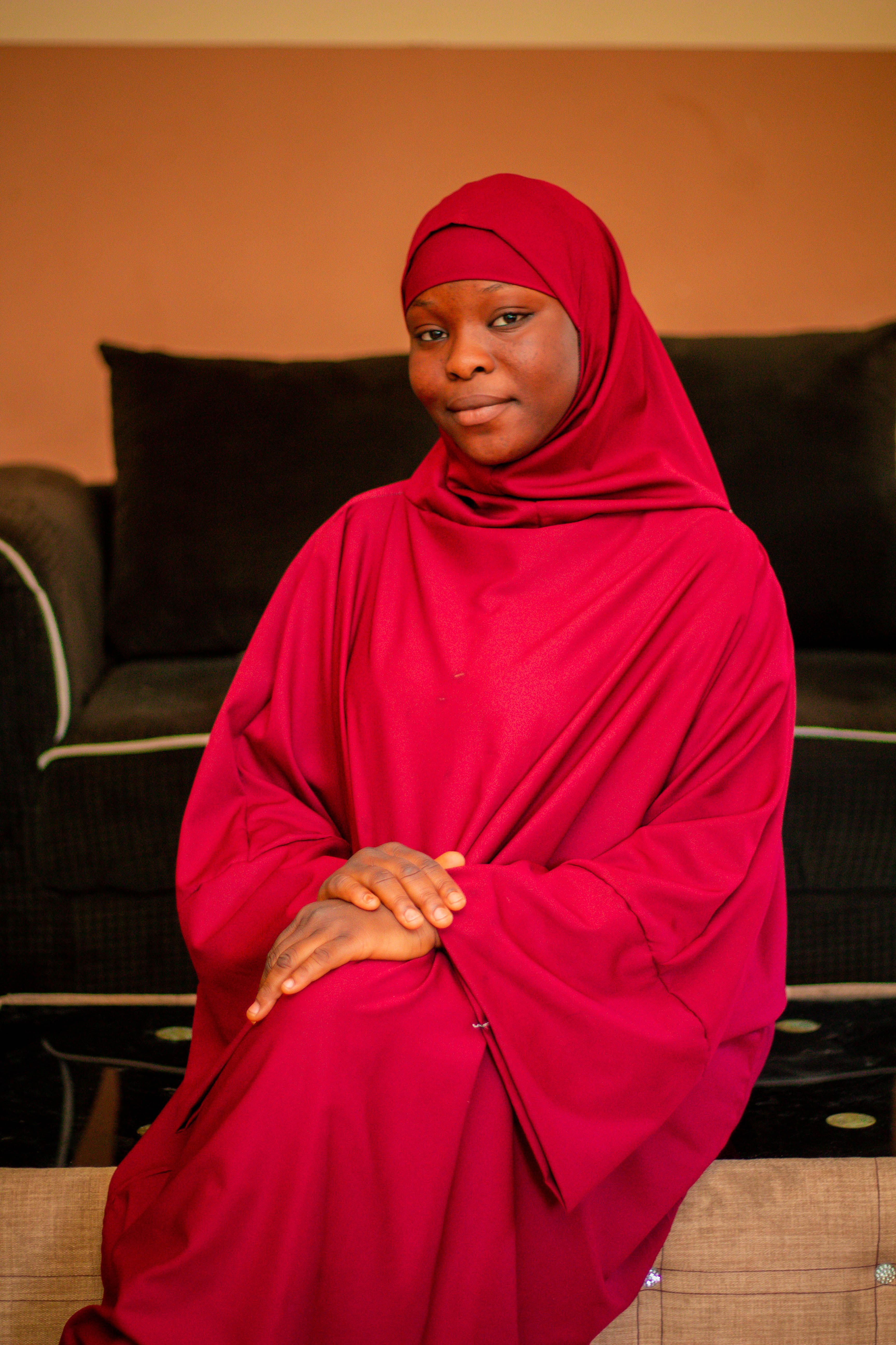 Portrait of Woman in Red Hijab Indoors · Free Stock Photo