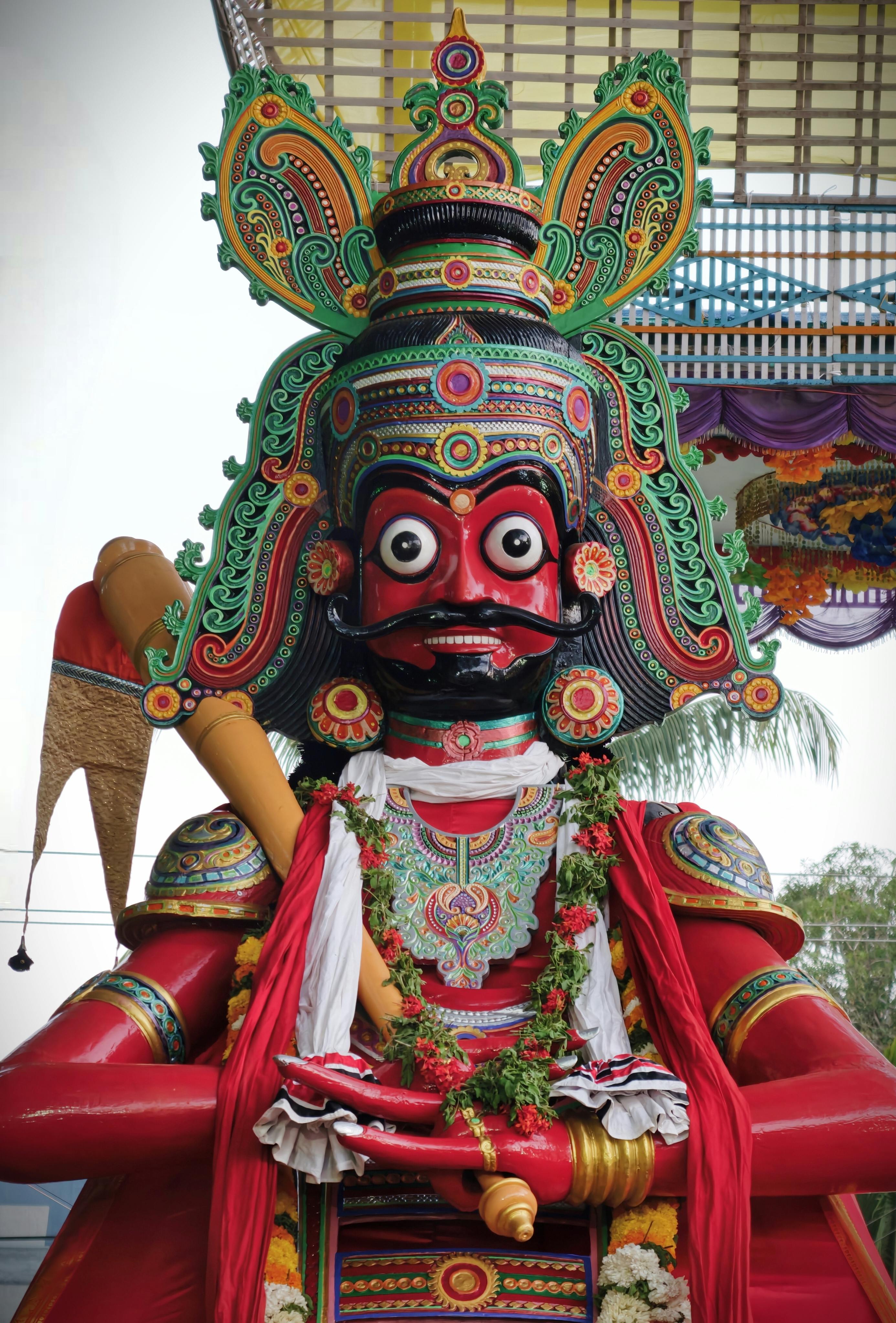 Vibrant Bheem statue at Kottuvally temple showcasing intricate Kerala artistry.
