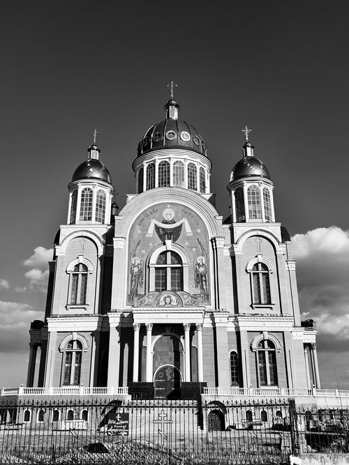 Free Stunning black and white photo of a grand Orthodox church with domes and religious frescoes. Stock Photo