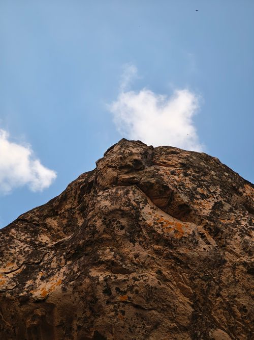 Free View of a striking rock formation reaching into a blue sky in Bhopal, India. Stock Photo