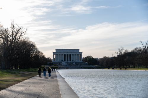 Free A serene day at Washington D.C.'s Lincoln Memorial with reflecting pool. Stock Photo