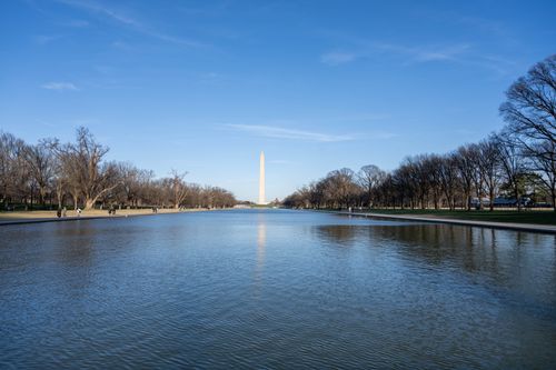 Free Washington Monument reflecting in the pool on a clear day in Washington D.C. Stock Photo