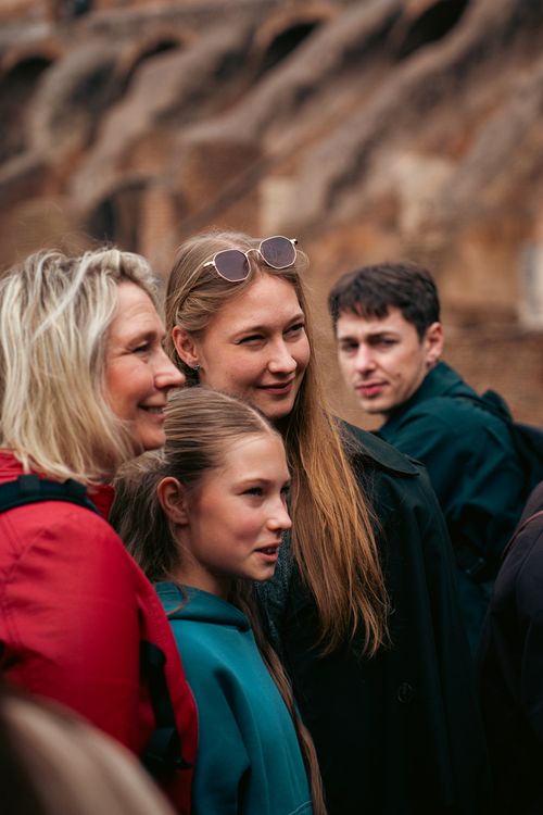 Free A group of tourists smiling and enjoying their time outdoors in Rome, Italy. Stock Photo