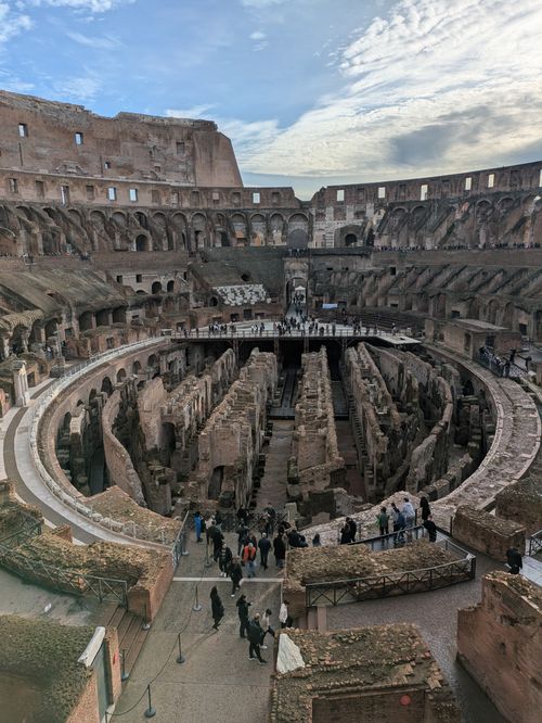 Free Explore the iconic Colosseum in Rome with a captivating view of its historic interior, a symbol of Roman architecture. Stock Photo