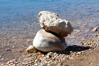 Balanced Rocks on Tranquil Beach Shoreline