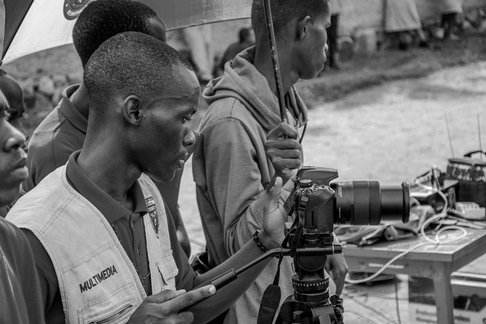 Filmmaker preparing a camera