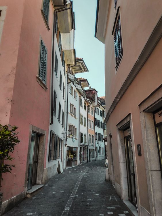 Charming European Narrow Street with Pastel Buildings · Free Stock Photo