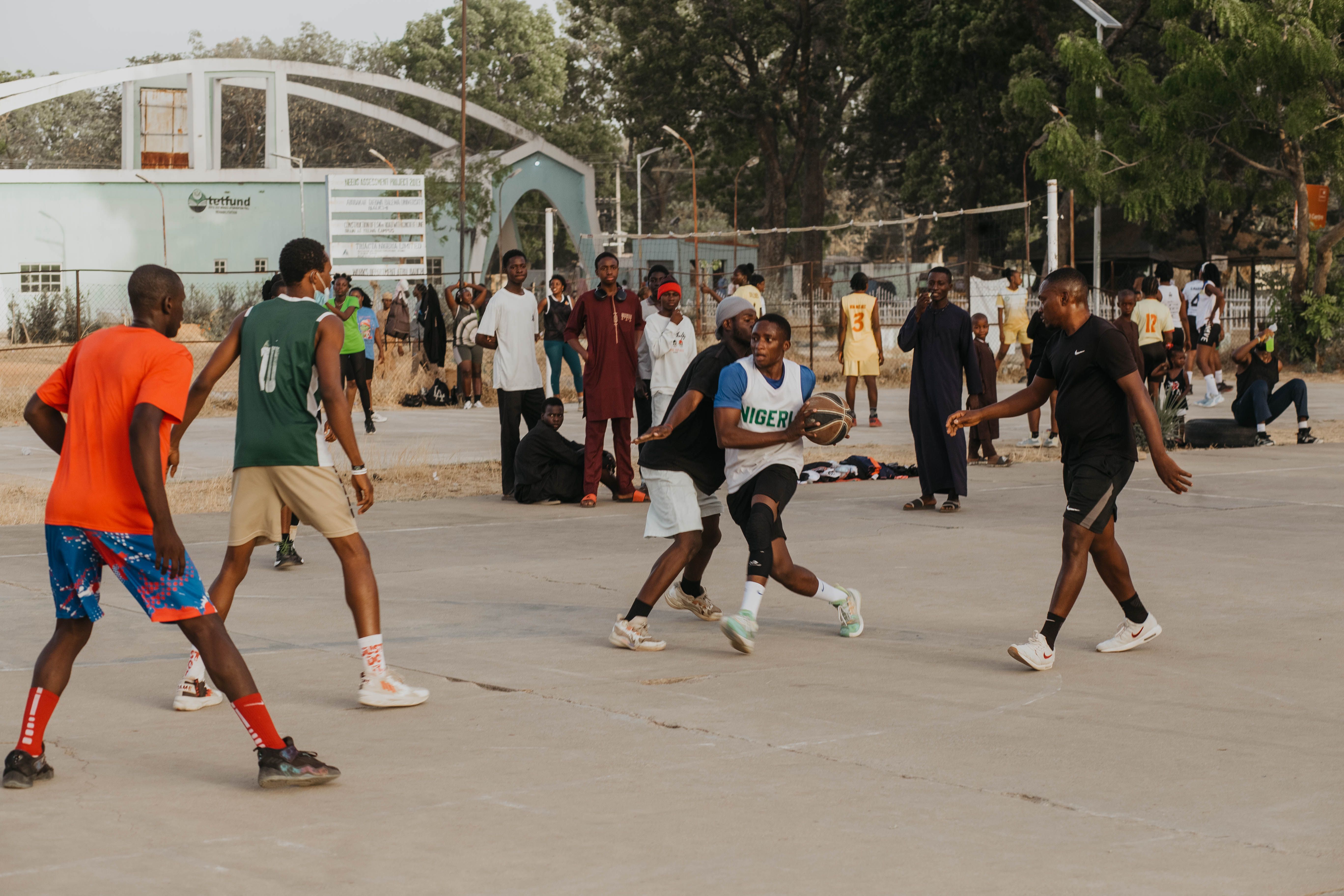 crowded outdoor sports court in Ho Ghana with players in jerseys