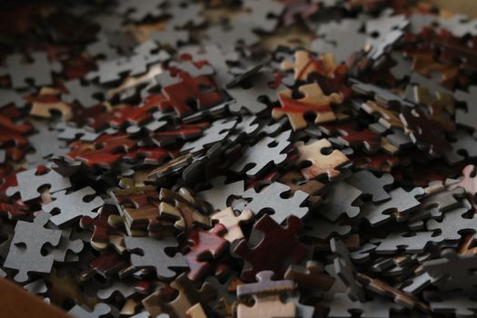 A detailed view of various colored puzzle pieces forming a complex pattern.