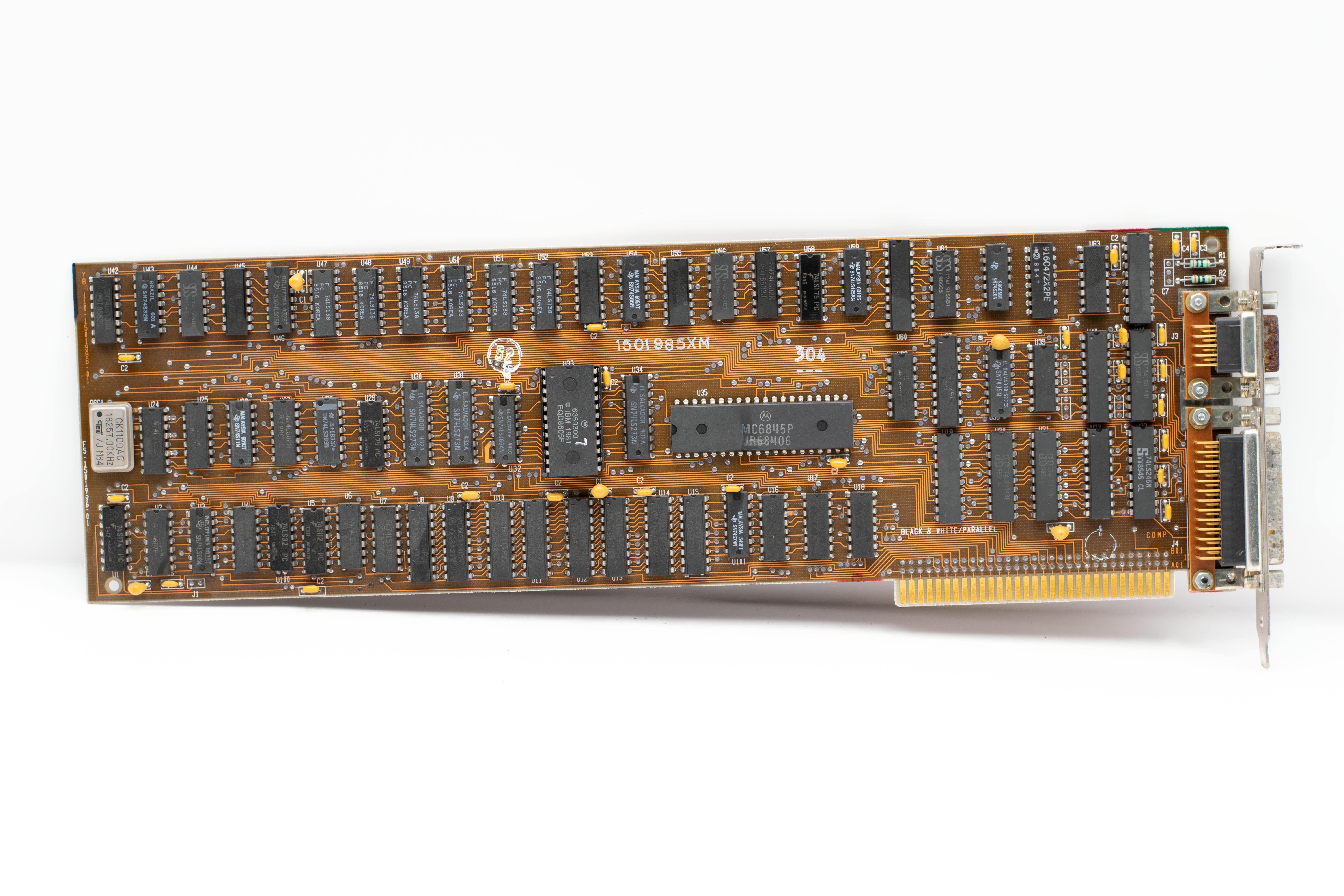 Detailed image of a vintage computer circuit board showcasing its intricate pathways and components.