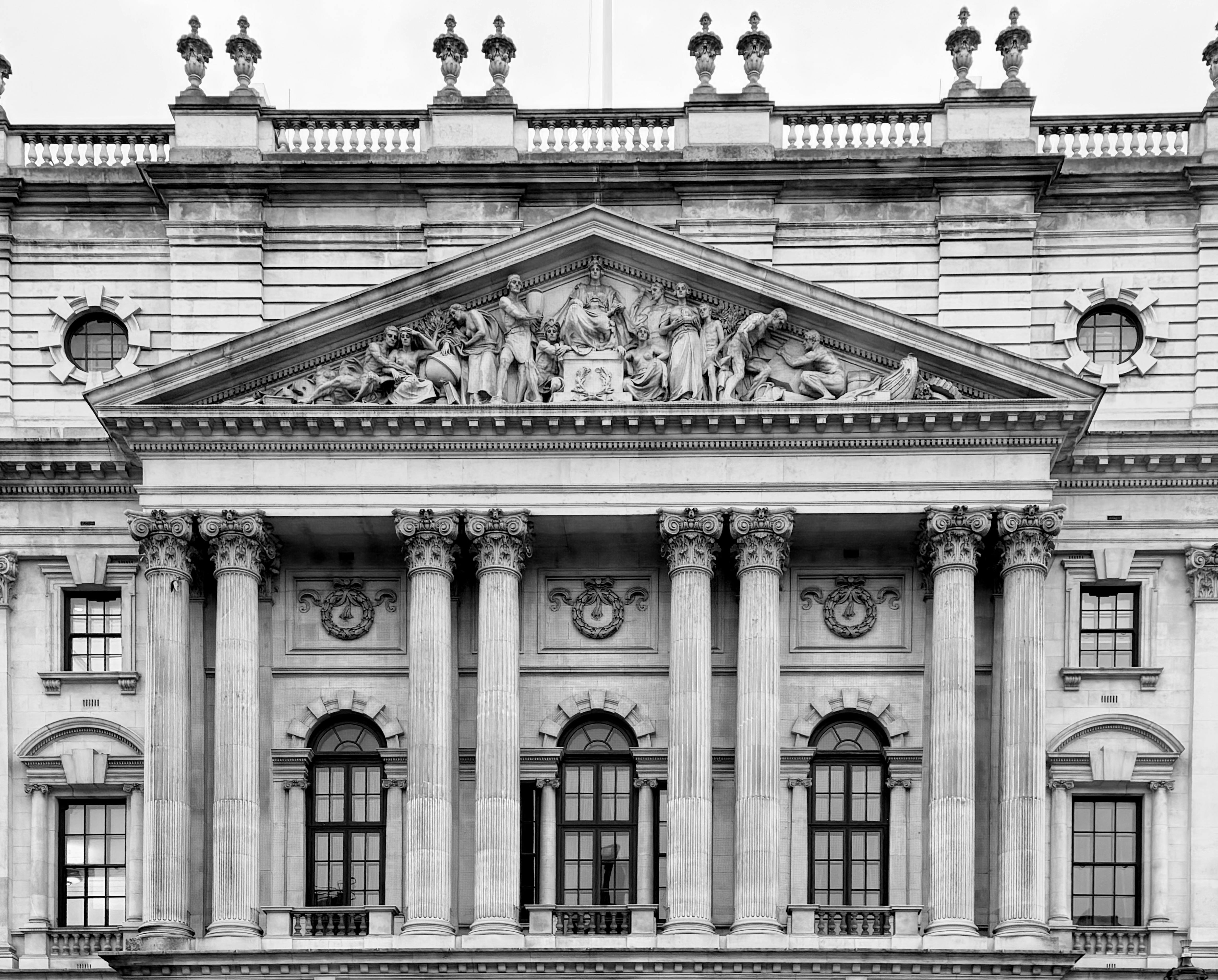Detailed black and white photo of a historic Westminster building facade in London.