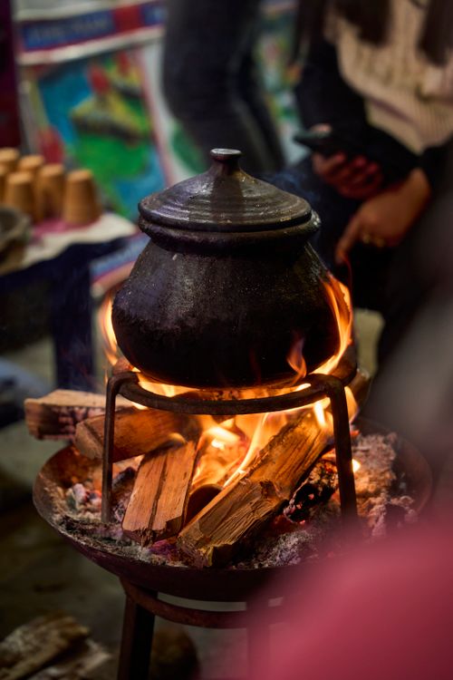Traditional Cooking Over Open Flame Indoors · Free Stock Photo