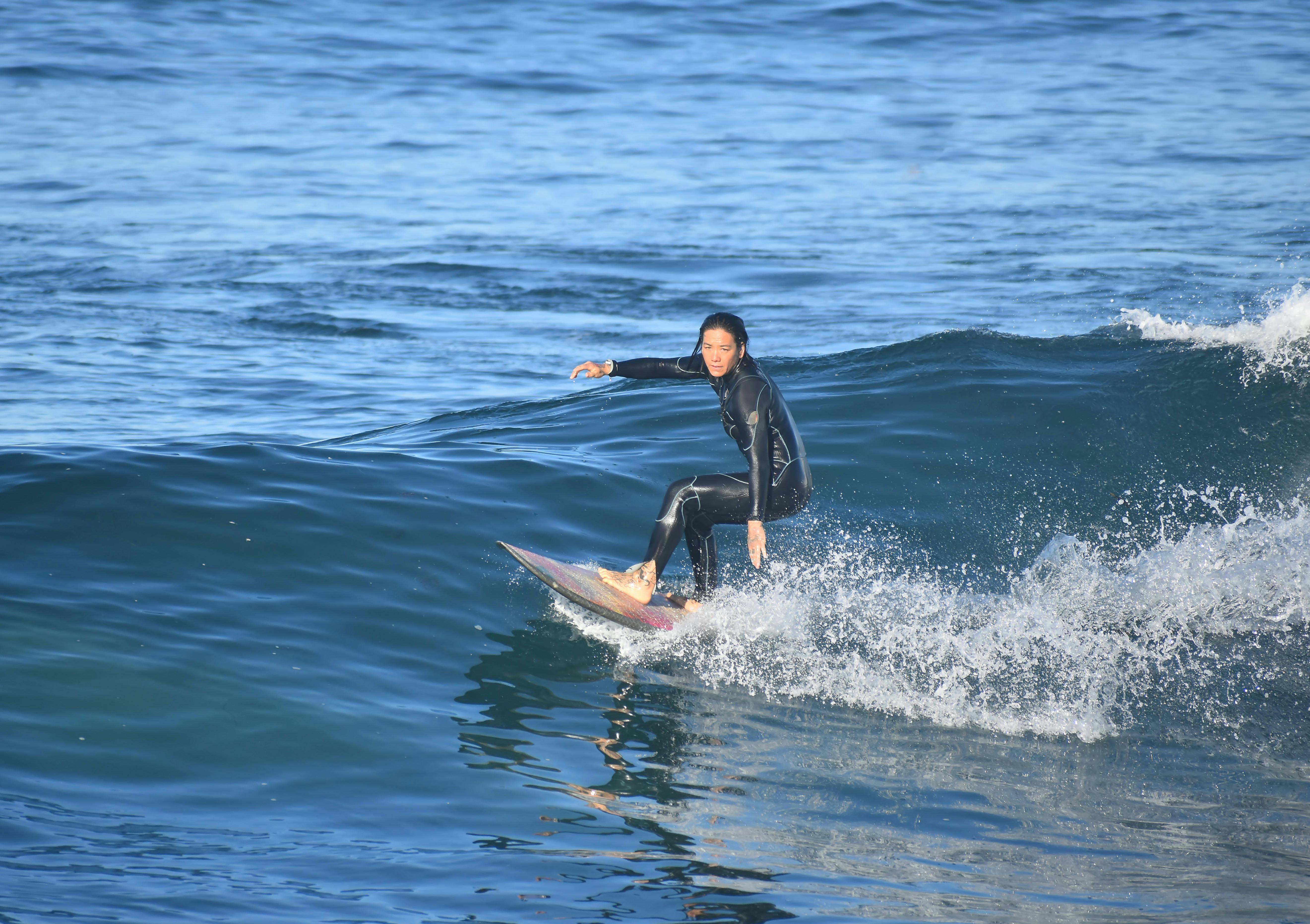 Surfboard stored safely indoors on a rack