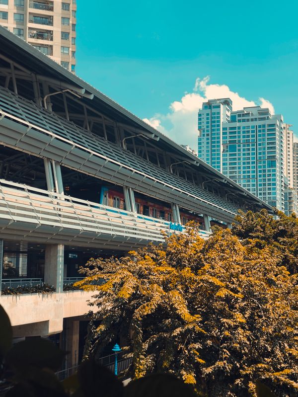 Urban train station amidst city skyscrapers