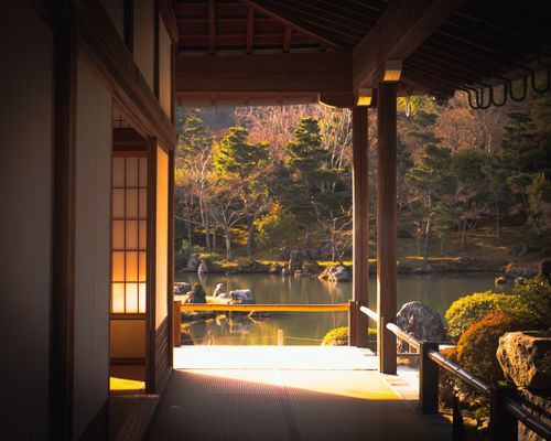 Free Serene view of a Japanese house overlooking a tranquil garden in Kyoto. Stock Photo