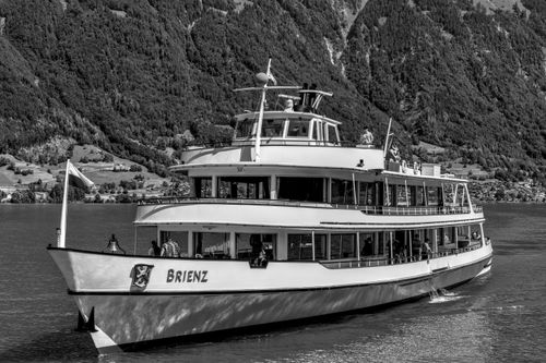 Free Enjoy a picturesque cruise on Lake Brienz, surrounded by the Swiss Alps' majestic beauty. Stock Photo