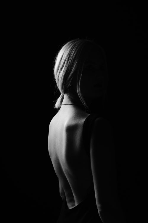 Portrait of a Woman in the Dark · Free Stock Photo