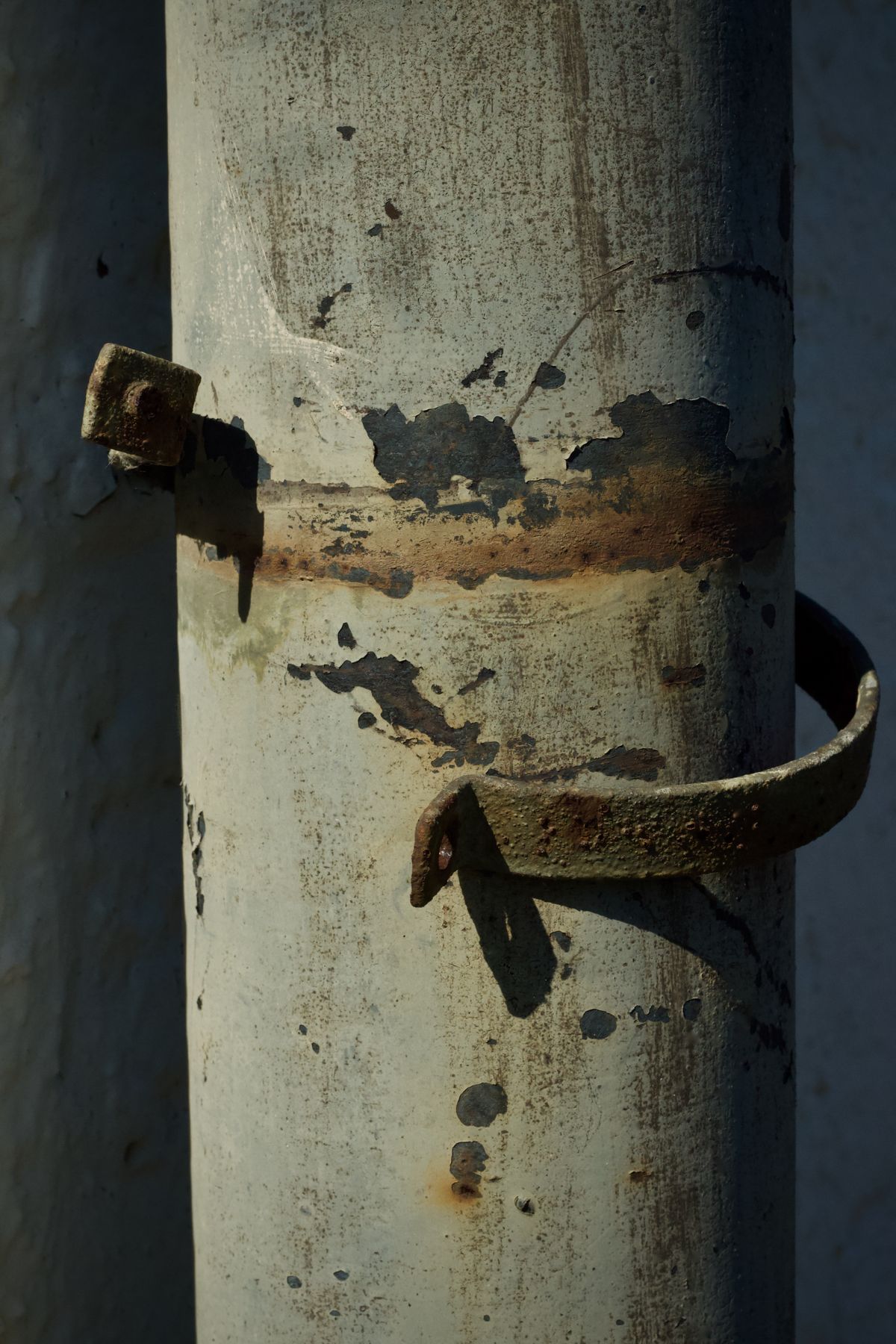 Old rusty pipe with peeling paint