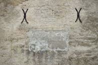 Textured Old Stone Wall with Iron Brackets