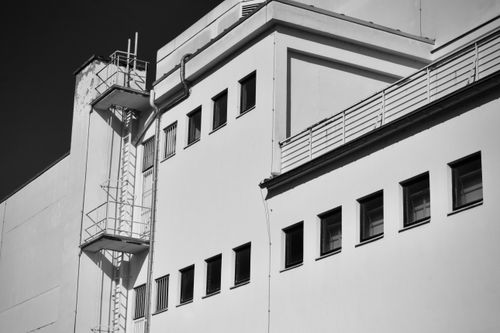 Free Black and white image showcasing a building's geometric design and industrial aesthetic. Stock Photo