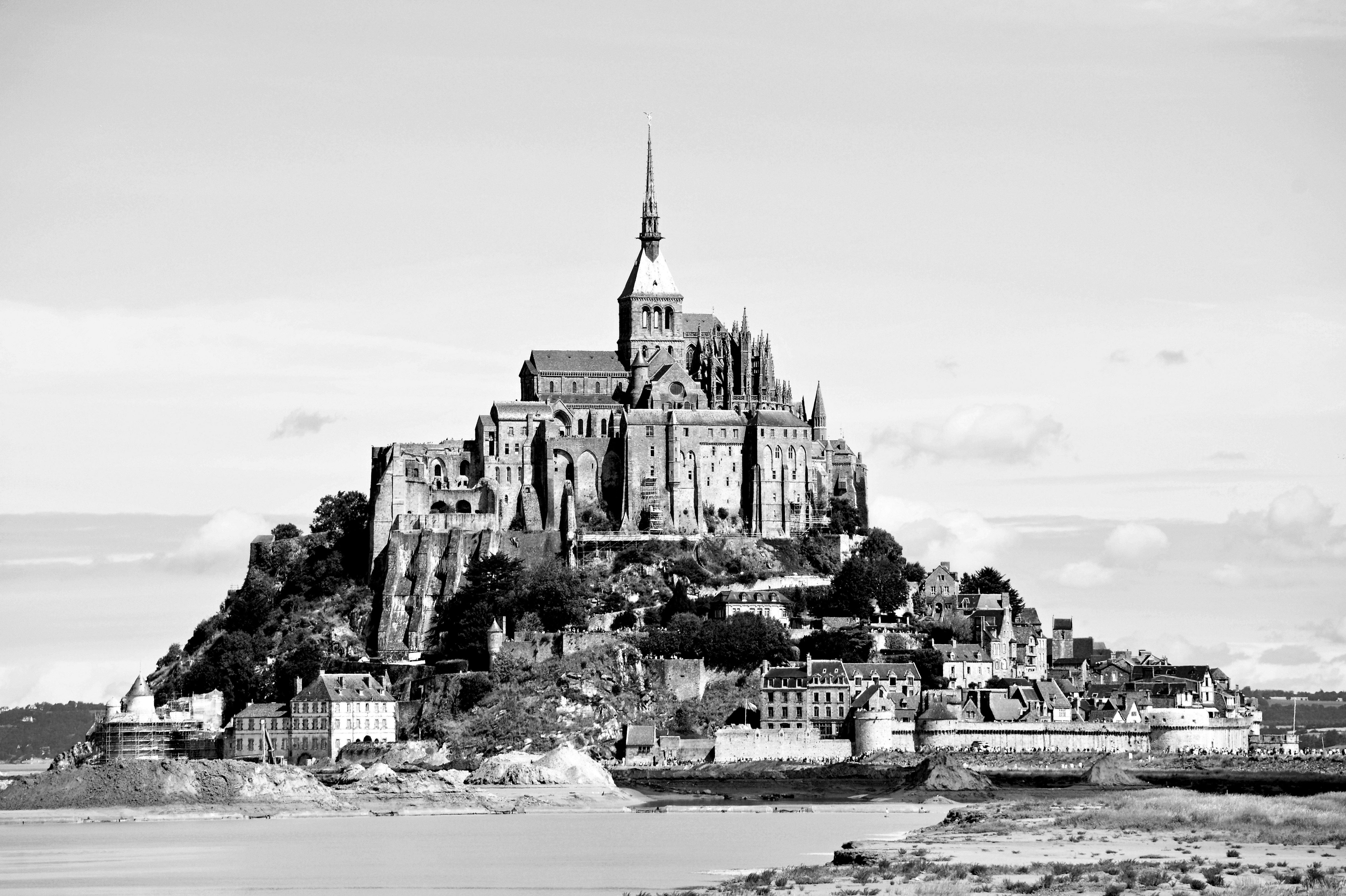 Stunning black and white view of the iconic Mont Saint-Michel monastery in France.