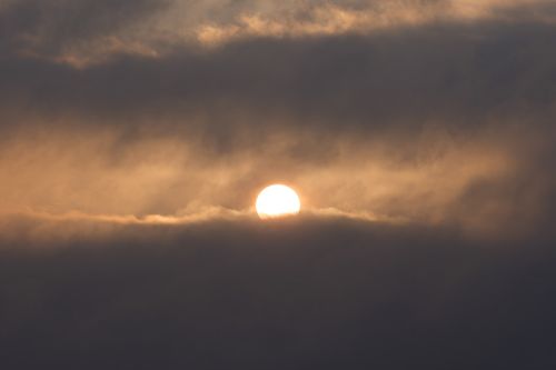 Free A captivating sunrise breaking through clouds at Cove Island Park, Stamford, Connecticut. Stock Photo