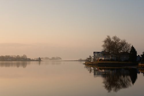 Free Beautiful sunrise over serene waters in Cove Island Park, Stamford, Connecticut. Stock Photo