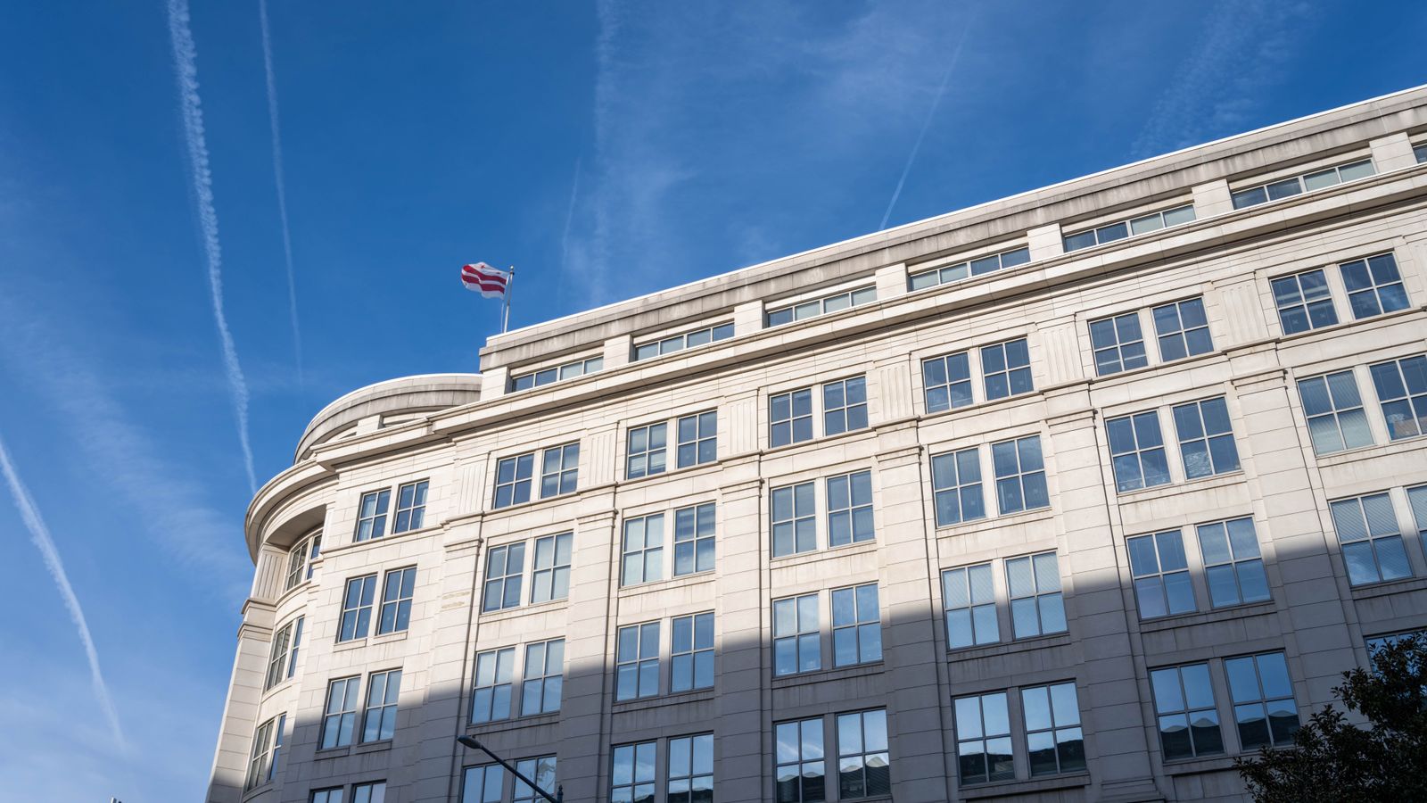 Elegant office building under a clear blue sky in Washington, D.C.