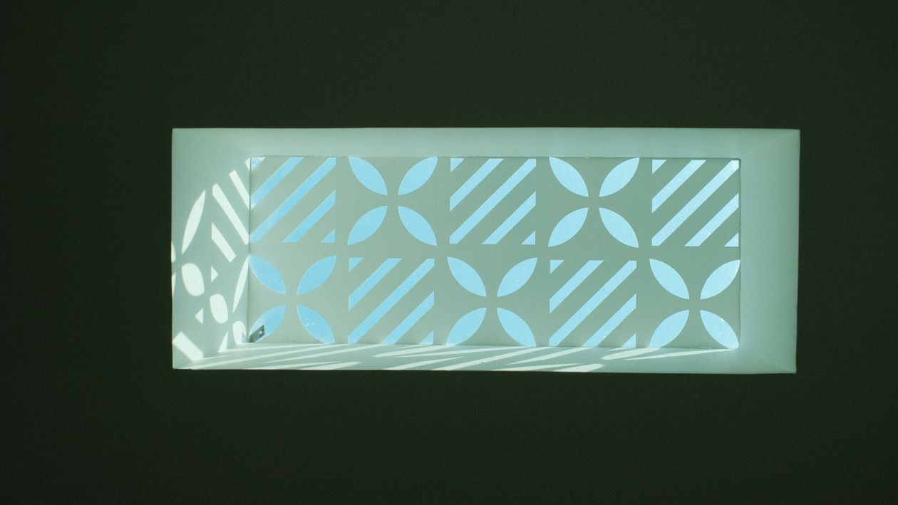Geometric Pattern Over Window Geometric Patterned Window with Natural Light · Free Stock Photo