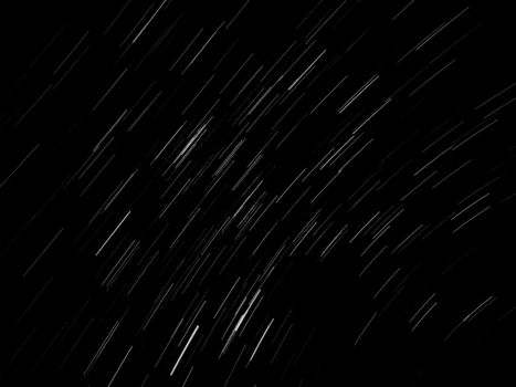Captivating long exposure of star trails at night, showcasing celestial movement across the dark sky.