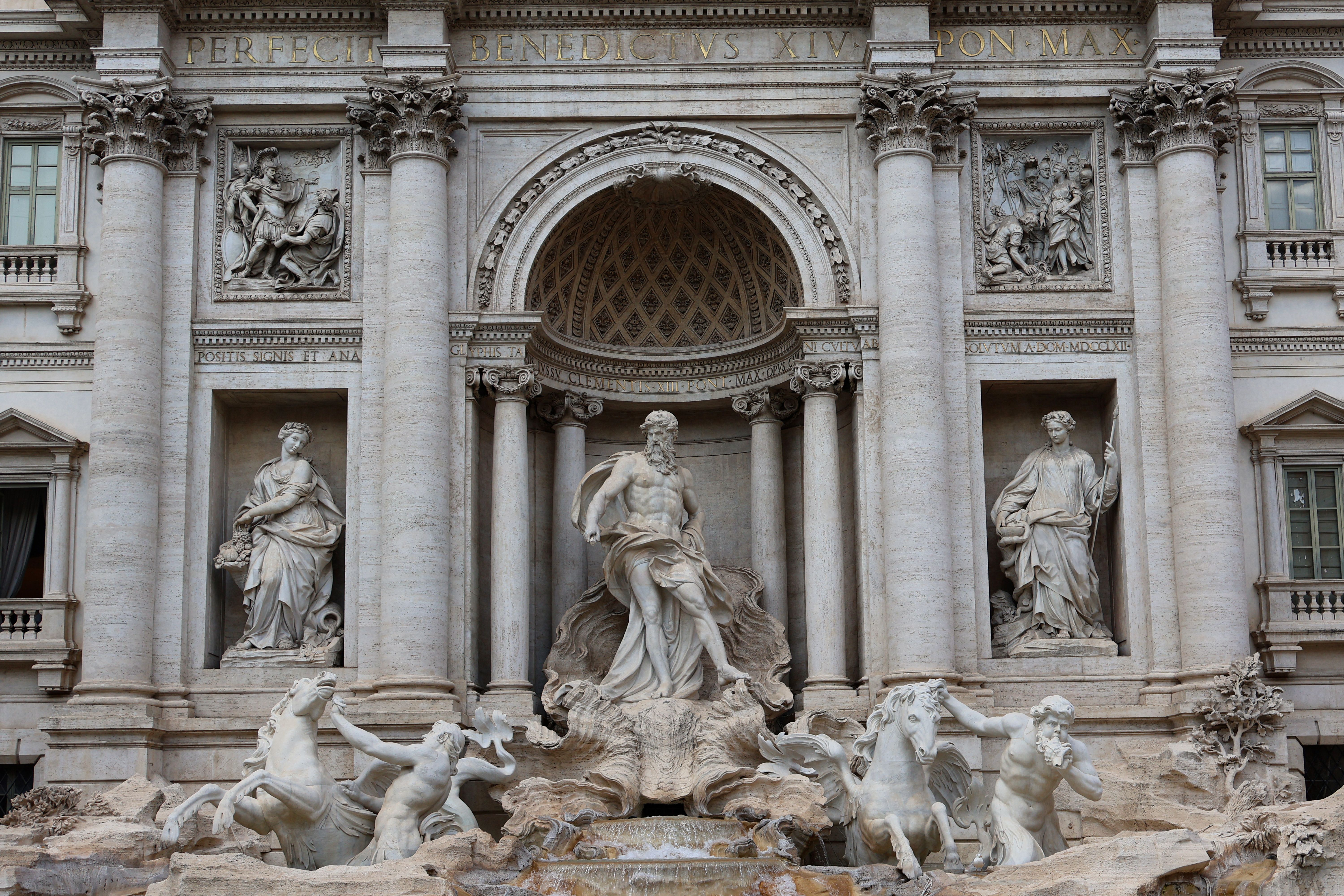 The iconic Trevi Fountain in Rome, showcasing its Baroque architecture and statues.