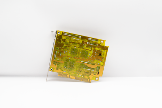 Close-up of a vintage circuit board showcasing retro technology and design.