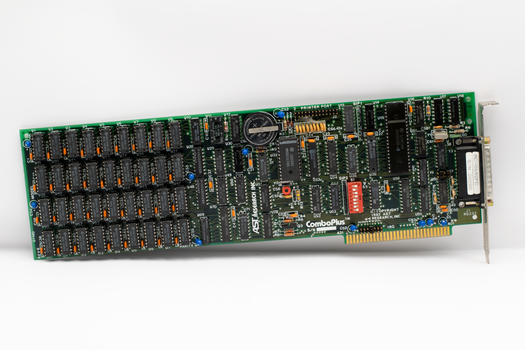 Close-up of a vintage computer circuit board featuring various electronic components.