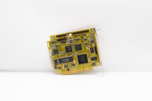 Antique circuit board showcasing vintage computing technology, isolated on a white background.