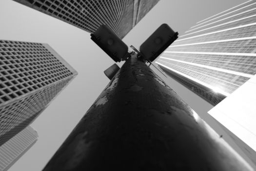 Low angle shot of skyscrapers in black and white, creating a dramatic urban scene.