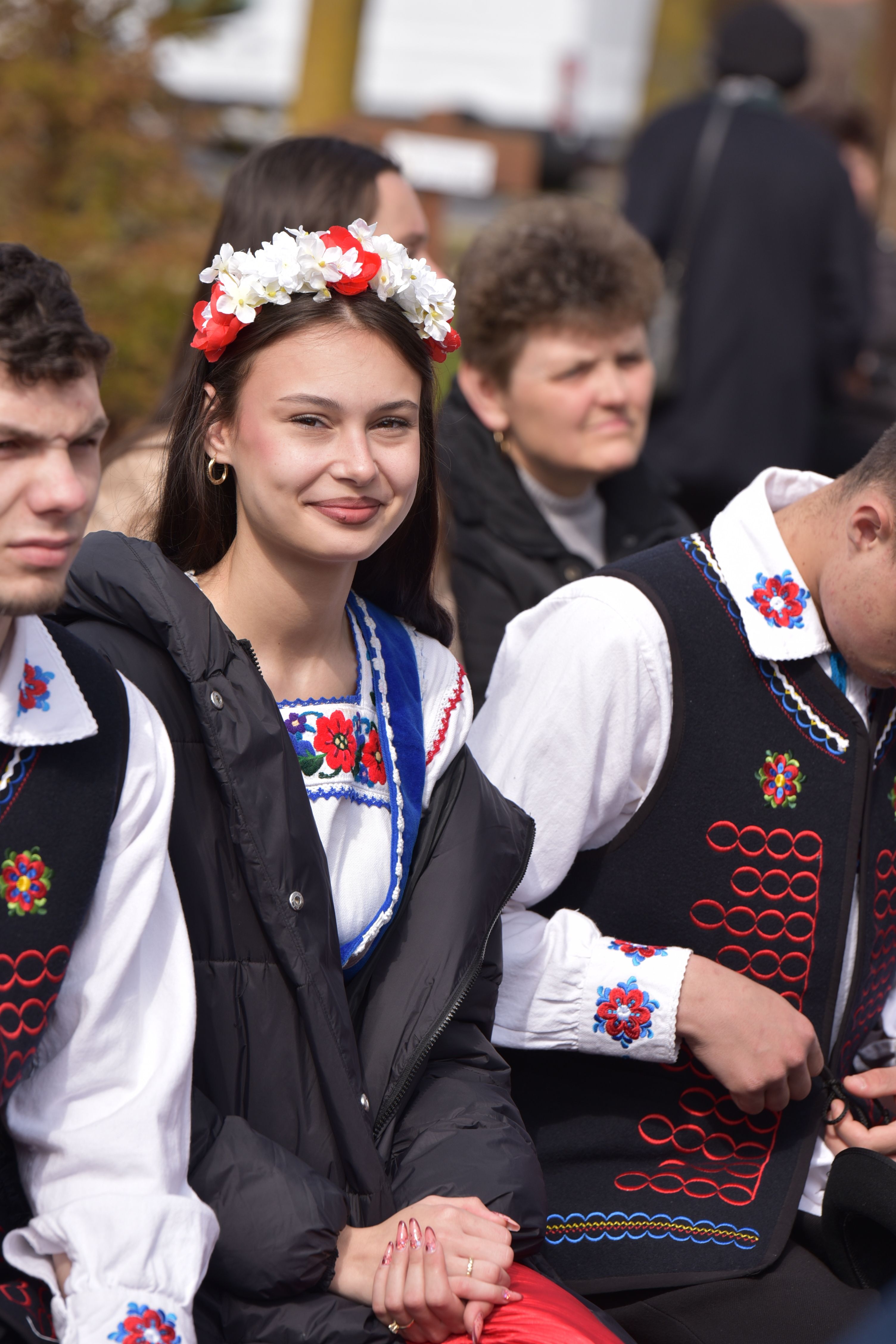 Group in traditional Hungarian folk costumes at an outdoor event in Máriapócs, Hungary.