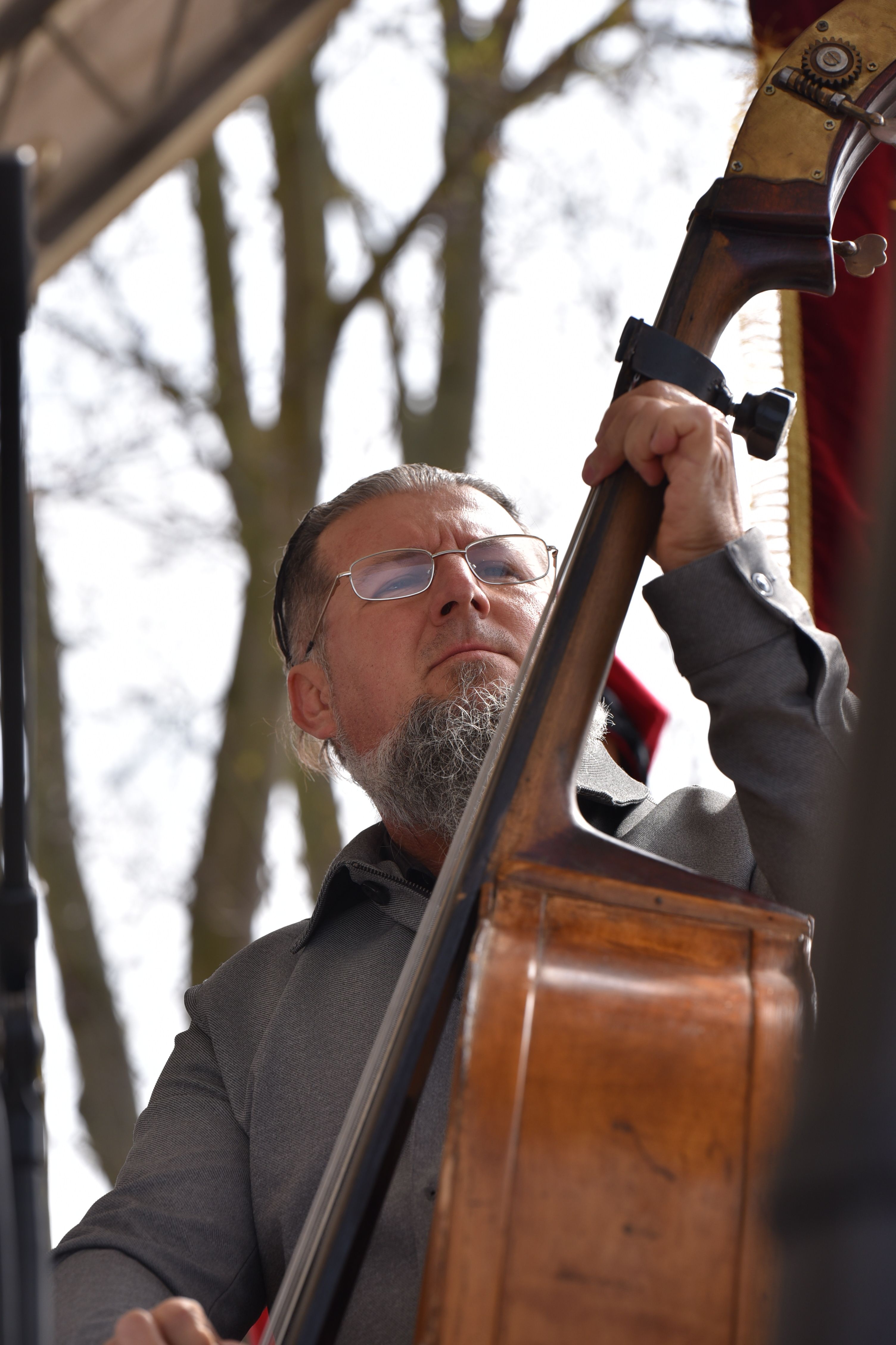 A musician performs on a double bass during an outdoor concert in Máriapócs, Hungary.