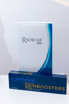 Close-up of Radiesse Duo and Restylane Skinboosters packaging highlighting aesthetics.