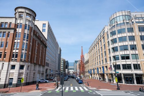 Free Urban street view of Washington D.C.'s architecture highlighting historic and modern buildings. Stock Photo