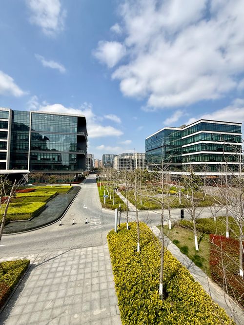 Free Modern architectural office buildings with open landscaping in Shanghai, China on a sunny day. Stock Photo