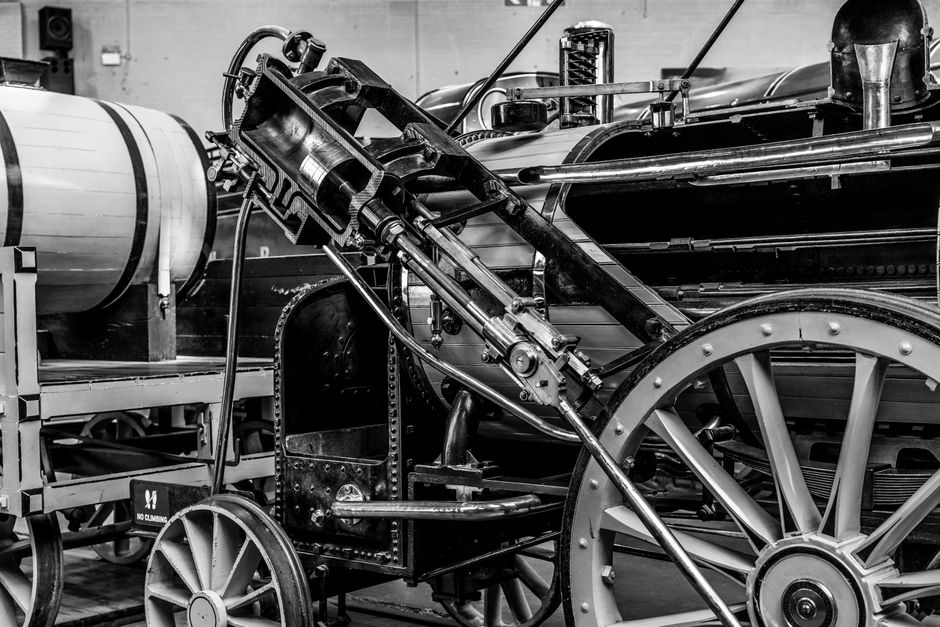 Classic black and white photo of a vintage steam engine showcasing its intricate machinery.