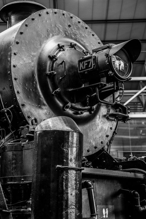 Free Monochrome image of a vintage steam locomotive, highlighting its industrial charm and historical significance. Stock Photo